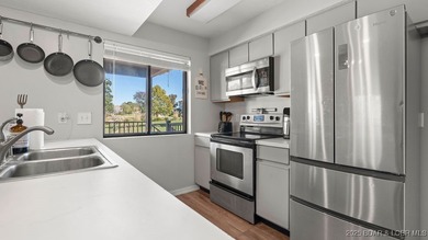 Welcome home to the Osage Vista's community. This top floor unit on Seasons Ridge At Four Seasons in Missouri - for sale on GolfHomes.com, golf home, golf lot
