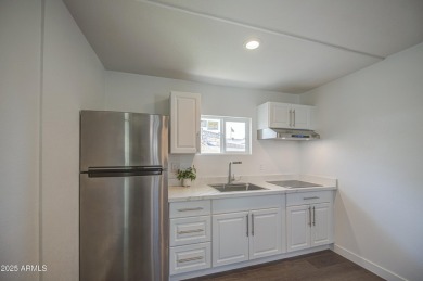 Beautifully remodeled home tucked away on a cul de sac lot in a on Encanto 18 Golf Course in Arizona - for sale on GolfHomes.com, golf home, golf lot