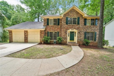 Welcome to this beautiful brick front home nestled on a sweeping on Hidden Hills Country Club in Georgia - for sale on GolfHomes.com, golf home, golf lot
