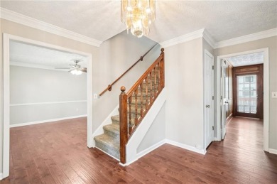 Welcome to this beautiful brick front home nestled on a sweeping on Hidden Hills Country Club in Georgia - for sale on GolfHomes.com, golf home, golf lot
