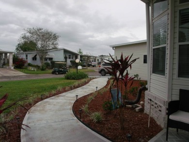 Beautiful 2 bedroom Palm Harbor Home with a double car garage on Schalamar Creek Golf and Country Club in Florida - for sale on GolfHomes.com, golf home, golf lot