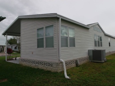 Beautiful 2 bedroom Palm Harbor Home with a double car garage on Schalamar Creek Golf and Country Club in Florida - for sale on GolfHomes.com, golf home, golf lot