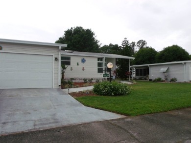 Beautiful 2 bedroom Palm Harbor Home with a double car garage on Schalamar Creek Golf and Country Club in Florida - for sale on GolfHomes.com, golf home, golf lot