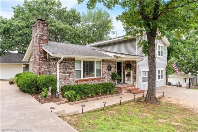 Welcome to this stunning tri-level home featuring four spacious on Vache-Grasse Country Club in Arkansas - for sale on GolfHomes.com, golf home, golf lot