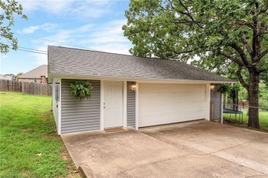 Welcome to this stunning tri-level home featuring four spacious on Vache-Grasse Country Club in Arkansas - for sale on GolfHomes.com, golf home, golf lot