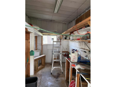 Fixer Upper! Needs TLC! This 960-square-foot doublewide home in on Twin Isles Country Club in Florida - for sale on GolfHomes.com, golf home, golf lot