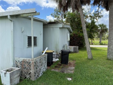 Fixer Upper! Needs TLC! This 960-square-foot doublewide home in on Twin Isles Country Club in Florida - for sale on GolfHomes.com, golf home, golf lot