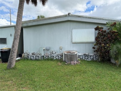 Fixer Upper! Needs TLC! This 960-square-foot doublewide home in on Twin Isles Country Club in Florida - for sale on GolfHomes.com, golf home, golf lot