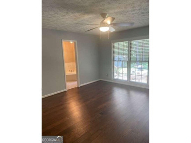 This ranch home is happily situated on a beautiful 1.03-acre lot on Honey Creek Country Club in Georgia - for sale on GolfHomes.com, golf home, golf lot