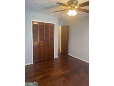 This ranch home is happily situated on a beautiful 1.03-acre lot on Honey Creek Country Club in Georgia - for sale on GolfHomes.com, golf home, golf lot