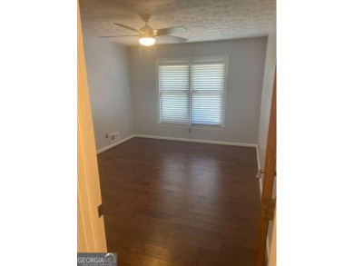 This ranch home is happily situated on a beautiful 1.03-acre lot on Honey Creek Country Club in Georgia - for sale on GolfHomes.com, golf home, golf lot