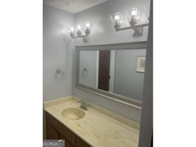 This ranch home is happily situated on a beautiful 1.03-acre lot on Honey Creek Country Club in Georgia - for sale on GolfHomes.com, golf home, golf lot