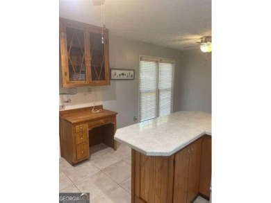 This ranch home is happily situated on a beautiful 1.03-acre lot on Honey Creek Country Club in Georgia - for sale on GolfHomes.com, golf home, golf lot