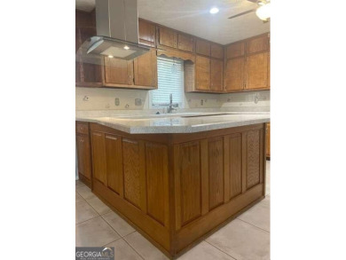 This ranch home is happily situated on a beautiful 1.03-acre lot on Honey Creek Country Club in Georgia - for sale on GolfHomes.com, golf home, golf lot