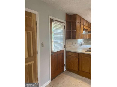 This ranch home is happily situated on a beautiful 1.03-acre lot on Honey Creek Country Club in Georgia - for sale on GolfHomes.com, golf home, golf lot