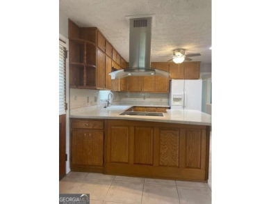This ranch home is happily situated on a beautiful 1.03-acre lot on Honey Creek Country Club in Georgia - for sale on GolfHomes.com, golf home, golf lot