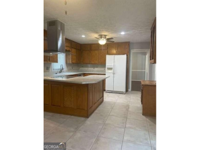 This ranch home is happily situated on a beautiful 1.03-acre lot on Honey Creek Country Club in Georgia - for sale on GolfHomes.com, golf home, golf lot