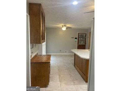 This ranch home is happily situated on a beautiful 1.03-acre lot on Honey Creek Country Club in Georgia - for sale on GolfHomes.com, golf home, golf lot