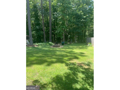 This ranch home is happily situated on a beautiful 1.03-acre lot on Honey Creek Country Club in Georgia - for sale on GolfHomes.com, golf home, golf lot