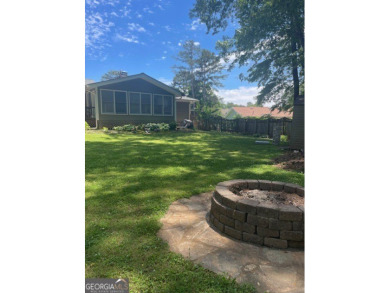 This ranch home is happily situated on a beautiful 1.03-acre lot on Honey Creek Country Club in Georgia - for sale on GolfHomes.com, golf home, golf lot