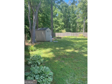 This ranch home is happily situated on a beautiful 1.03-acre lot on Honey Creek Country Club in Georgia - for sale on GolfHomes.com, golf home, golf lot