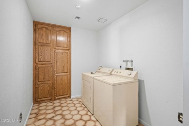 Welcome to this inviting single-family home situated along the on London Bridge Golf Course in Arizona - for sale on GolfHomes.com, golf home, golf lot