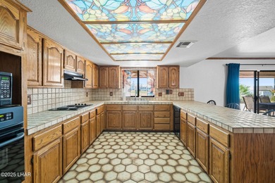 Welcome to this inviting single-family home situated along the on London Bridge Golf Course in Arizona - for sale on GolfHomes.com, golf home, golf lot