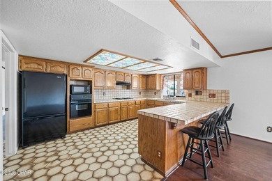 Welcome to this inviting single-family home situated along the on London Bridge Golf Course in Arizona - for sale on GolfHomes.com, golf home, golf lot