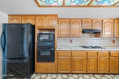 Welcome to this inviting single-family home situated along the on London Bridge Golf Course in Arizona - for sale on GolfHomes.com, golf home, golf lot