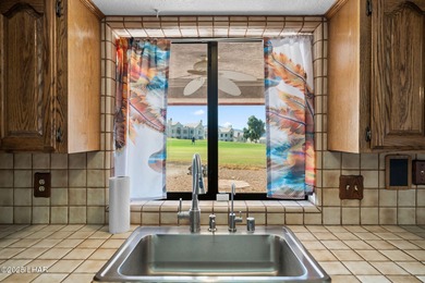 Welcome to this inviting single-family home situated along the on London Bridge Golf Course in Arizona - for sale on GolfHomes.com, golf home, golf lot