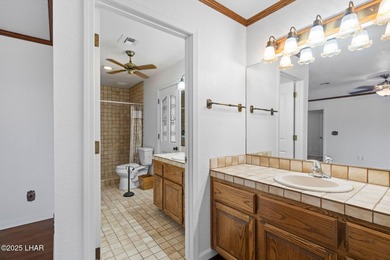 Welcome to this inviting single-family home situated along the on London Bridge Golf Course in Arizona - for sale on GolfHomes.com, golf home, golf lot