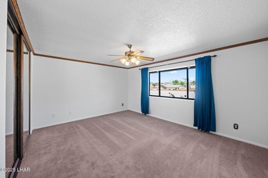 Welcome to this inviting single-family home situated along the on London Bridge Golf Course in Arizona - for sale on GolfHomes.com, golf home, golf lot