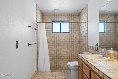 Welcome to this inviting single-family home situated along the on London Bridge Golf Course in Arizona - for sale on GolfHomes.com, golf home, golf lot