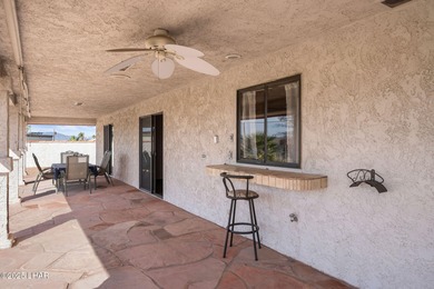 Welcome to this inviting single-family home situated along the on London Bridge Golf Course in Arizona - for sale on GolfHomes.com, golf home, golf lot