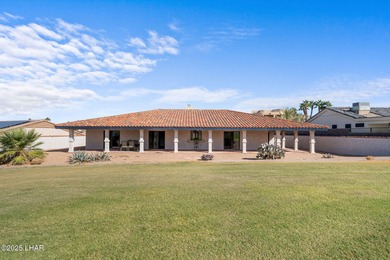 Welcome to this inviting single-family home situated along the on London Bridge Golf Course in Arizona - for sale on GolfHomes.com, golf home, golf lot