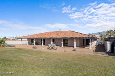 Welcome to this inviting single-family home situated along the on London Bridge Golf Course in Arizona - for sale on GolfHomes.com, golf home, golf lot