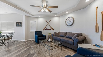 Enjoy incredible lake views from this spacious 4-bedroom, 3-bath on Tan-Tar-A Golf Club in Missouri - for sale on GolfHomes.com, golf home, golf lot