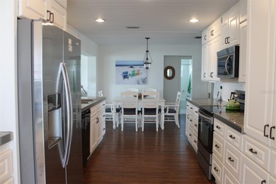 Welcome to this stunning and updated Ebbtide model home on Mainlands Golf Club in Florida - for sale on GolfHomes.com, golf home, golf lot