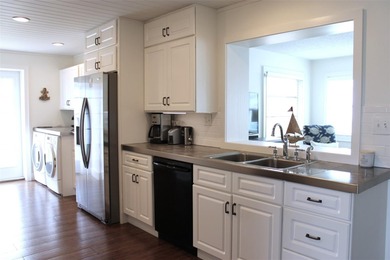 Welcome to this stunning and updated Ebbtide model home on Mainlands Golf Club in Florida - for sale on GolfHomes.com, golf home, golf lot