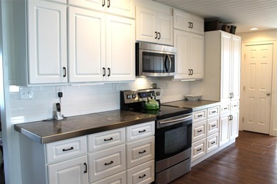 Welcome to this stunning and updated Ebbtide model home on Mainlands Golf Club in Florida - for sale on GolfHomes.com, golf home, golf lot