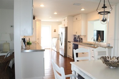 Welcome to this stunning and updated Ebbtide model home on Mainlands Golf Club in Florida - for sale on GolfHomes.com, golf home, golf lot