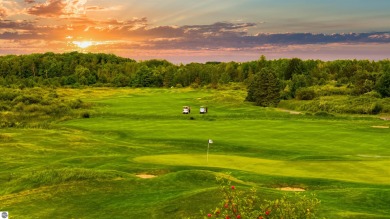Experience luxury living on the 11th fairway of The Bear Golf on Grand Traverse Resort and Spa in Michigan - for sale on GolfHomes.com, golf home, golf lot