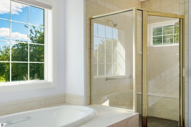 Experience luxury living on the 11th fairway of The Bear Golf on Grand Traverse Resort and Spa in Michigan - for sale on GolfHomes.com, golf home, golf lot