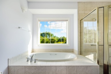 Experience luxury living on the 11th fairway of The Bear Golf on Grand Traverse Resort and Spa in Michigan - for sale on GolfHomes.com, golf home, golf lot