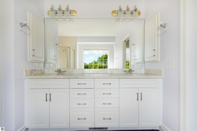Experience luxury living on the 11th fairway of The Bear Golf on Grand Traverse Resort and Spa in Michigan - for sale on GolfHomes.com, golf home, golf lot
