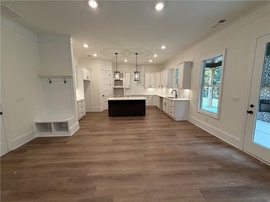 Stunning 2-story home with a 3rd car garage in a coveted on Traditions of Braselton Golf Club in Georgia - for sale on GolfHomes.com, golf home, golf lot