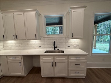 Stunning 2-story home with a 3rd car garage in a coveted on Traditions of Braselton Golf Club in Georgia - for sale on GolfHomes.com, golf home, golf lot