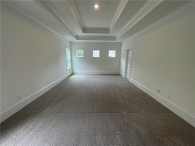 Stunning 2-story home with a 3rd car garage in a coveted on Traditions of Braselton Golf Club in Georgia - for sale on GolfHomes.com, golf home, golf lot