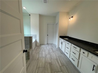 Stunning 2-story home with a 3rd car garage in a coveted on Traditions of Braselton Golf Club in Georgia - for sale on GolfHomes.com, golf home, golf lot