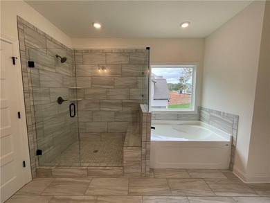 Stunning 2-story home with a 3rd car garage in a coveted on Traditions of Braselton Golf Club in Georgia - for sale on GolfHomes.com, golf home, golf lot